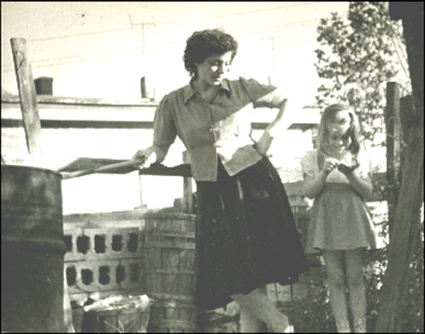 Hanging out with my mother in the back of the yard, burning the day's trash.